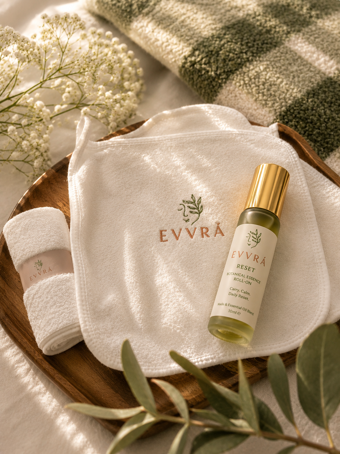 Essential Roll-On on EVVRA towel in a neutral setting