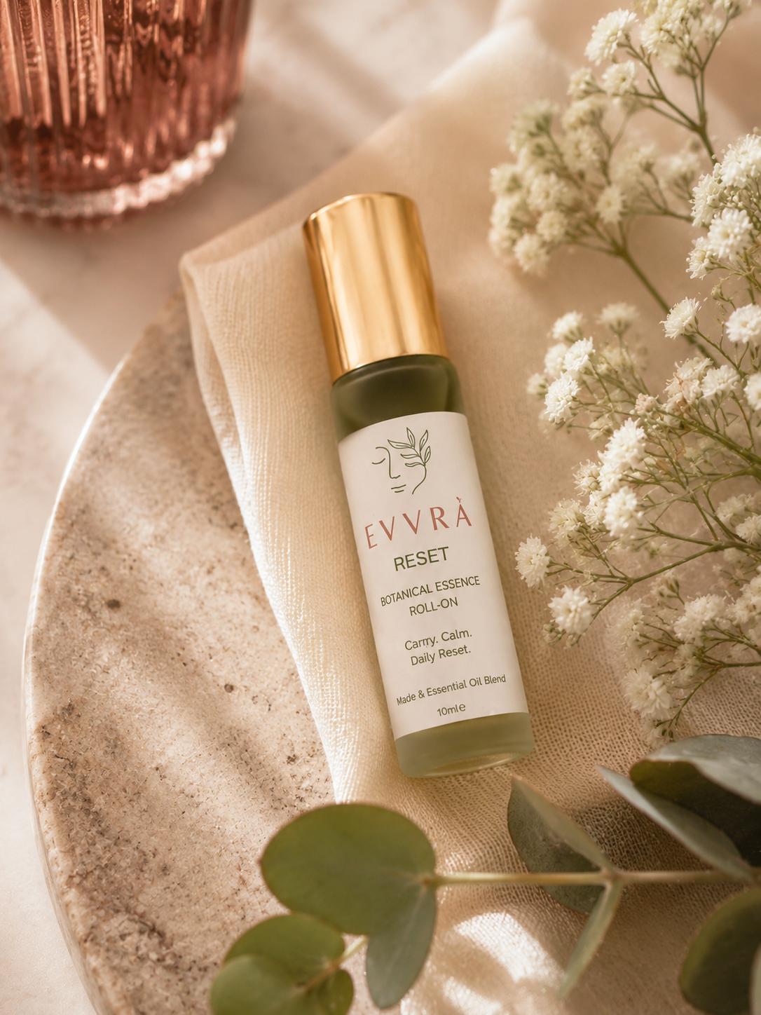 Essential Roll-On on EVVRA towel in a neutral setting